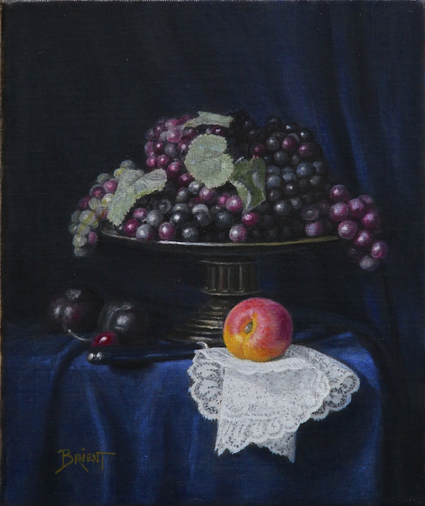 A large plate of grapes, plums, an apricot